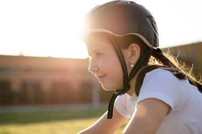 Portrait of an 11 year old girl in a protective sports helmet