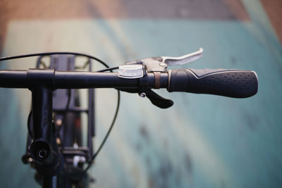 Close-up of bicycle on street