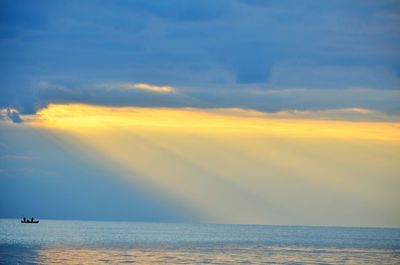 Scenic view of calm sea at sunset