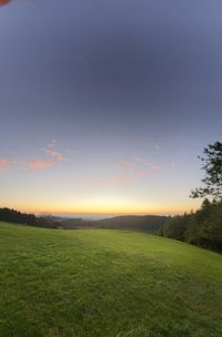 Scenic view of landscape against sky during sunset