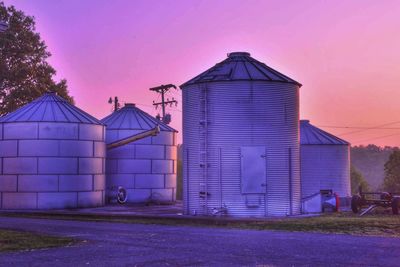 Buildings against sky at sunset