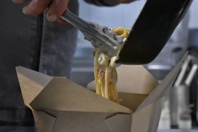 Close-up of man preparing food