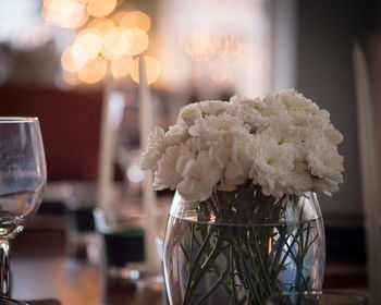 Close-up of illuminated flower on table