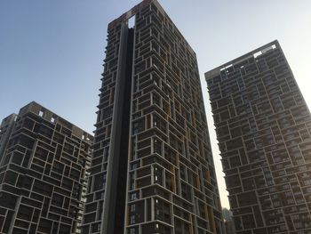 Low angle view of skyscrapers against clear sky