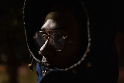 Close-up of young man at night