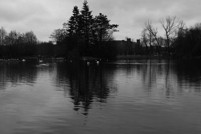 Scenic view of lake against cloudy sky