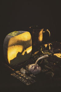 Close-up of drink on table against black background