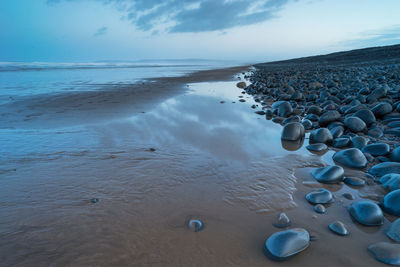 Scenic view of beach against sky