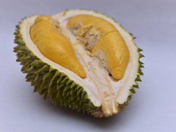 Close-up of lemon slice against white background