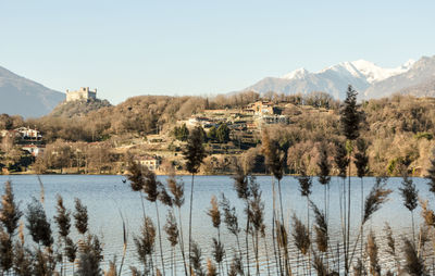 Panoramic view of lake and mountains against clear sky