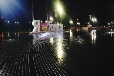 View of swimming pool at night