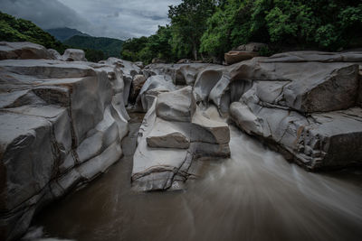 Water flowing amidst rock formation