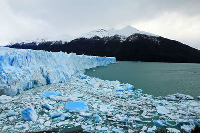 Scenic view of frozen lake against mountain