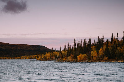 Scenic view of lake against sky during sunset