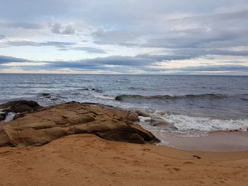 Scenic view of beach against sky