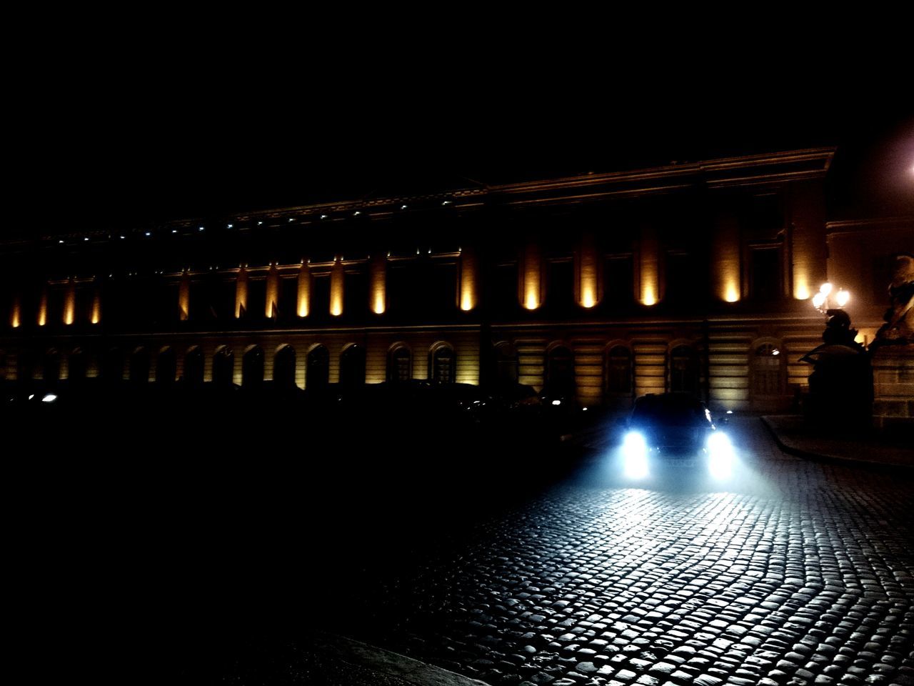 illuminated, night, architecture, built structure, indoors, in a row, dark, repetition, lighting equipment, architectural column, no people, light - natural phenomenon, arch, history, pattern, light, copy space, empty, column, building