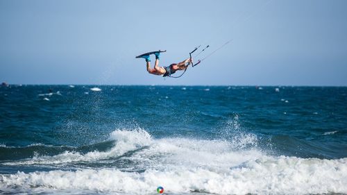 People surfing in sea