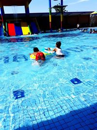 People swimming in pool