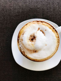 High angle view of cappuccino on table