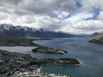 Scenic view of lake by mountains against sky queenstown