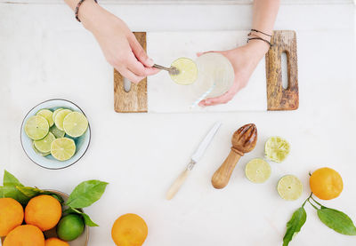 High angle view of woman preparing food on table