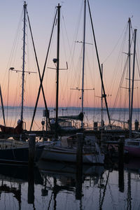 Boats moored at harbor