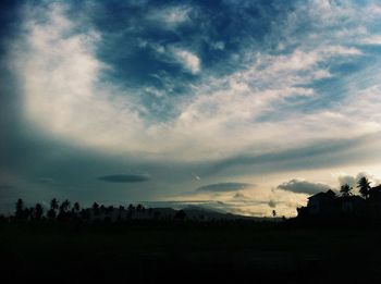 Scenic view of landscape against cloudy sky