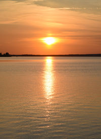 Scenic view of sea against romantic sky at sunset