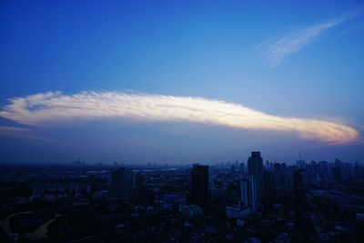 Cityscape against cloudy sky