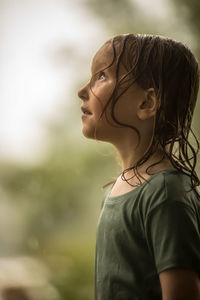 Portrait of young woman standing outdoors