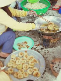 Midsection of woman preparing food on table