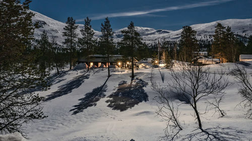 Scenic view of snow covered mountains against sky