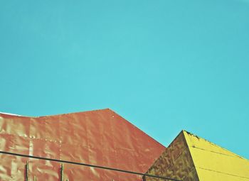 Low angle view of built structure against blue sky