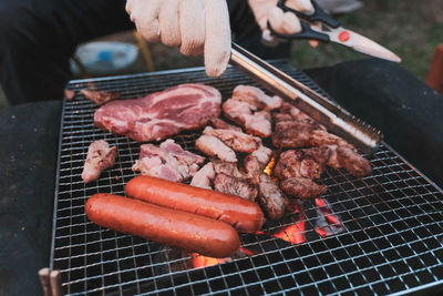 High angle view of meat on barbecue grill