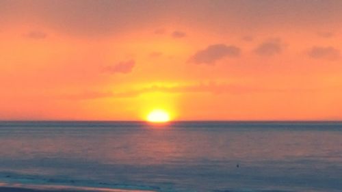 View of calm sea at sunset