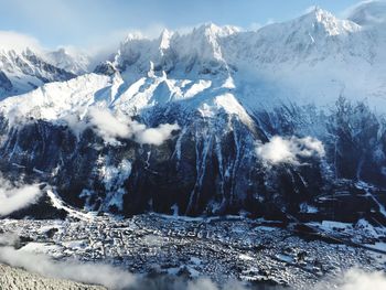 Scenic view of snowcapped mountains against sky