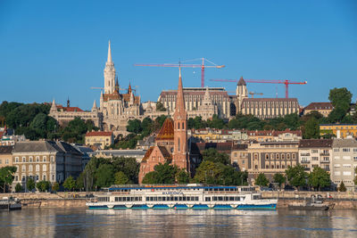 Budapest, hungary 18.08.2021. buda town architecture and danube river on a sunny summer morning