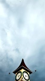 Low angle view of clock tower against sky