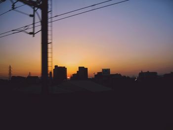 Silhouette of city at sunset