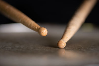 Close-up of drumsticks on drum