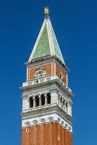 Low angle view of clock tower against sky