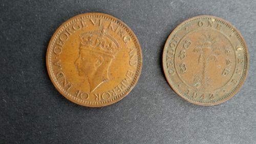 Close-up of coins on white background