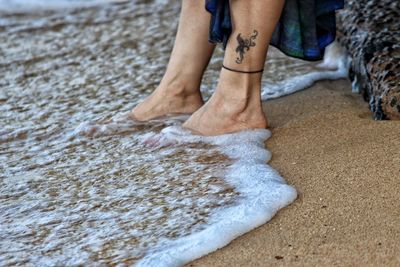 Low section of people on beach