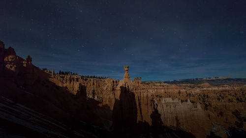 Scenic view of rock formations at night