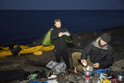 View of tourists camping at sea