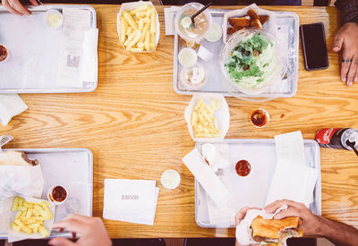 High angle view of man having food on table