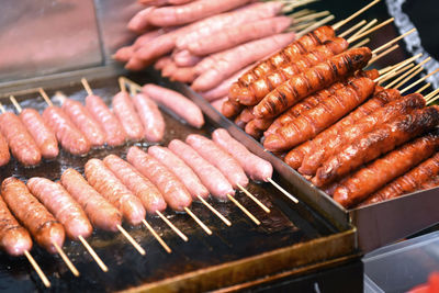 High angle view of meat on barbecue grill