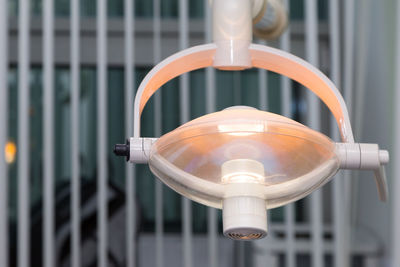 Close-up of illuminated medical equipment in operating room