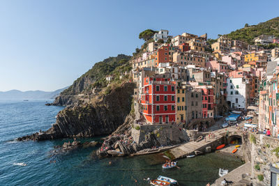 Panoramic view of sea and buildings against clear sky