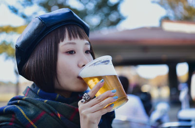 Young woman drinking glass